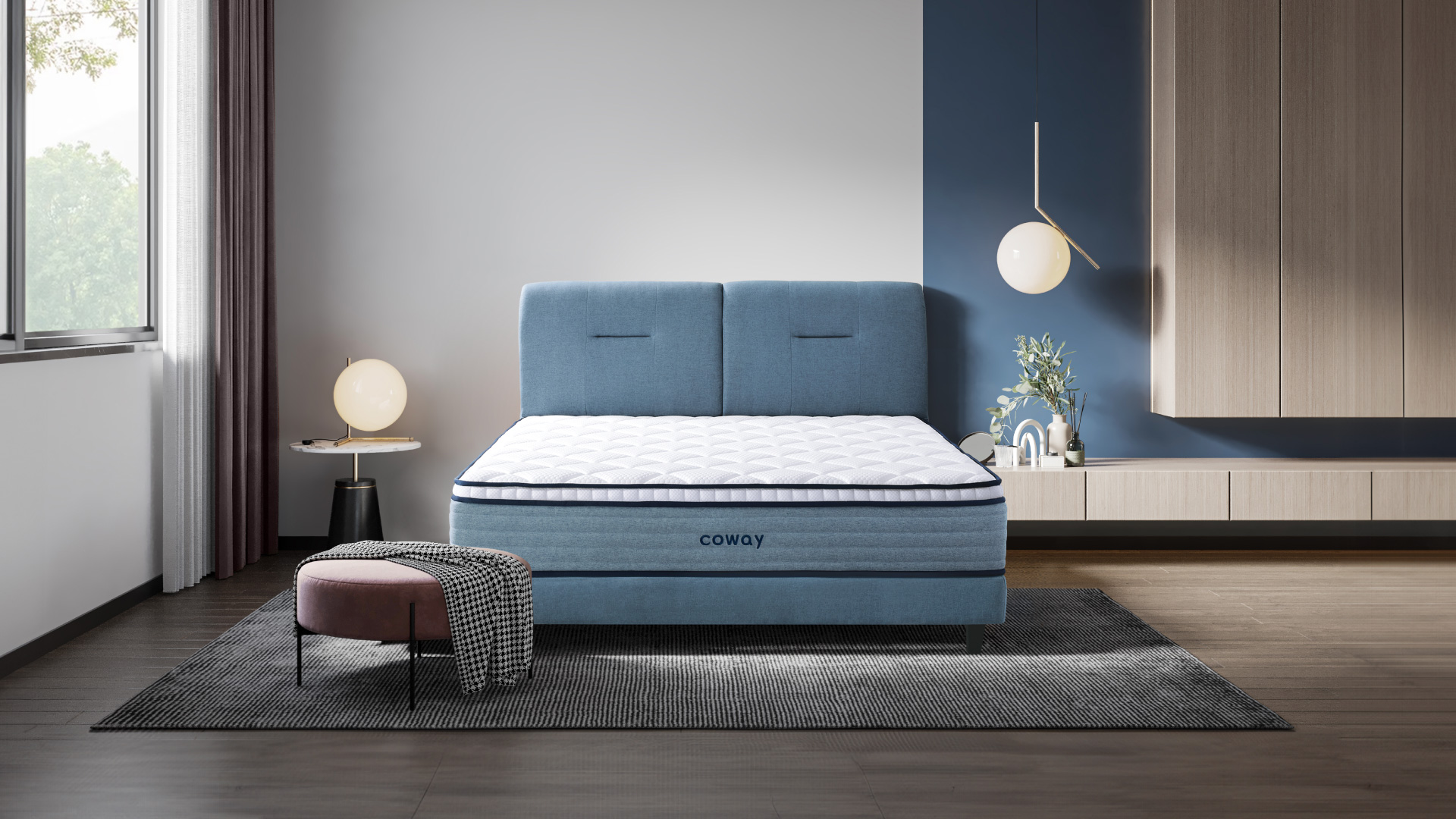 coway-prime-lite-series-mattress-at-the-center-of-the-room-with-a-rug-underneath-and-a-low-chair-with-a-rug-draped-across.jpg